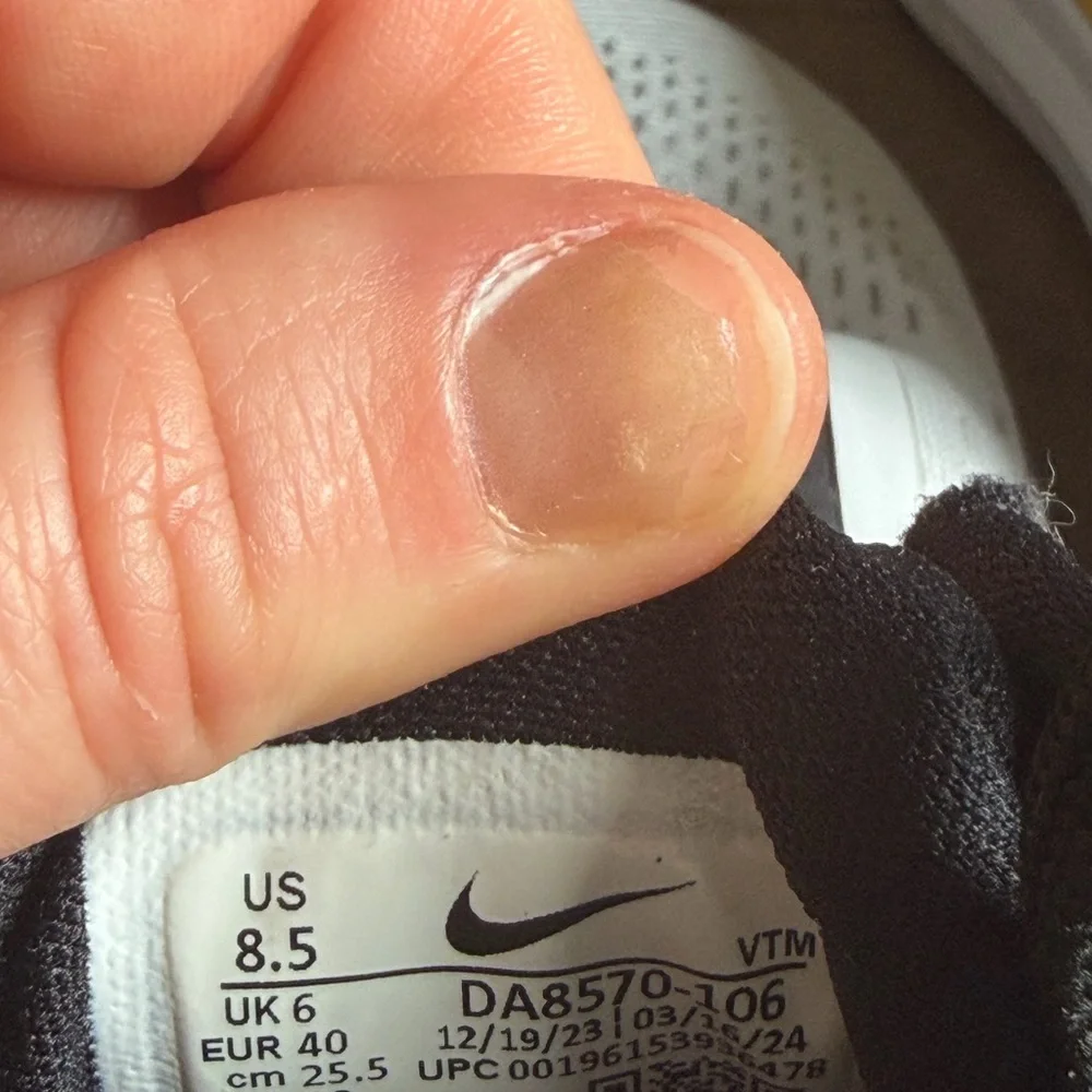 Nike Women’s White Running Sneakers with Black, Pink & Gold Accents